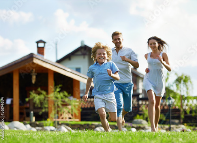 family running across the lawn